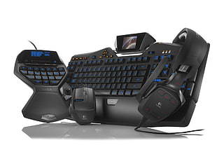 set of three black gaming computer keyboard, mouse, and headphones