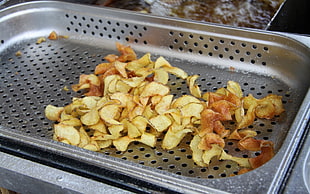 fried potato on gray stainless steel tray