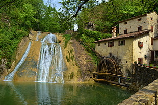 waterfalls near house illustration
