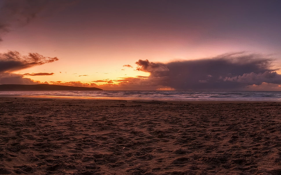 landscape photography of sand near ocean during golden hour HD wallpaper