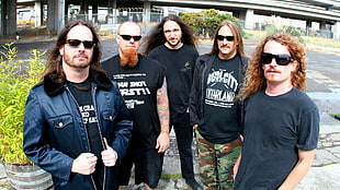 five man in black shirts band