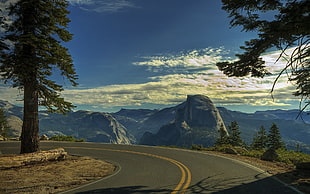 curved road overlooking mountain HD wallpaper