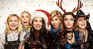 closeup photo of women wearing Christmas costumes