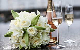 white flower bouquet and wine glasses