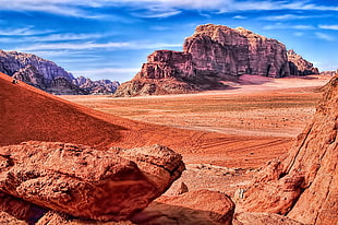 landscape photo of brown mountain and desert during daytime, wadi rum, jordan