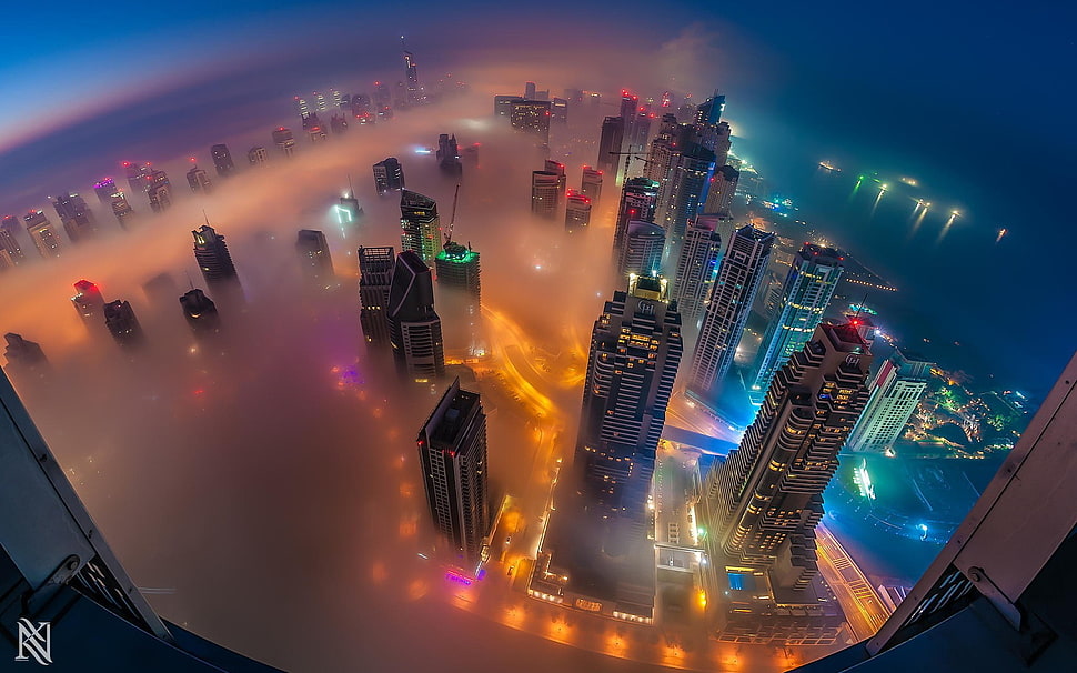high-angle photography of city covered with fog during night HD wallpaper