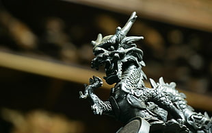 selective focus of dragon figurine