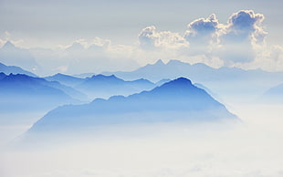 blue mountains under white clouds