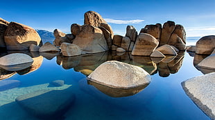 body of water near rocks, rock, nature, water, sky blue HD wallpaper