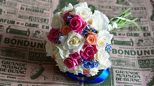 pink, white, and blue rose bouquet