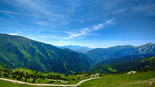 green mountain near winding road during daytime HD wallpaper