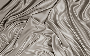 grey ruffled satin textile