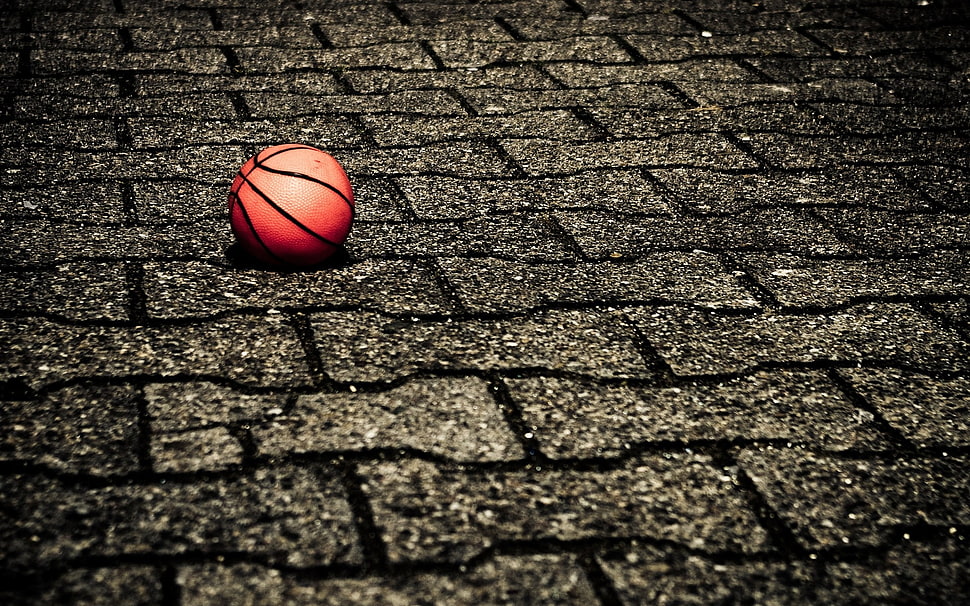 orange basketball on grey concrete brick flooring HD wallpaper