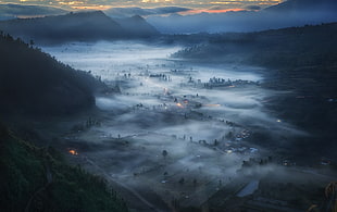 aerial photography of fog covered town