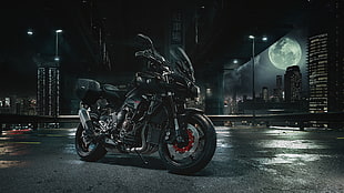 photography of black touring motorcycle
