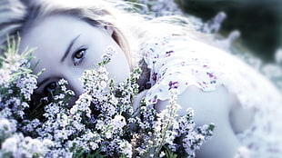 woman lying on flowers