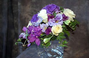 bouquet of white, purple, and yellow flowers