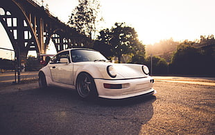 white Porsche 911 under the bridge at daytime HD wallpaper