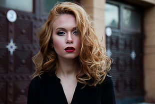 blonde haired woman in black blouse