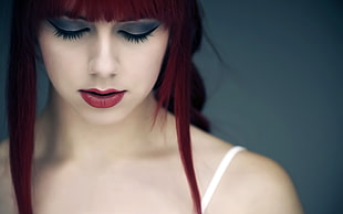 selective focus photo of woman with red lips and red hair