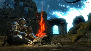 knight sitting in front bonfire