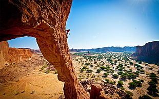 man on canyon mountain gliding photography HD wallpaper
