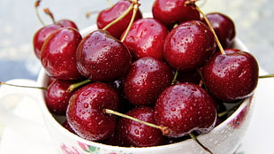 photo of cherry fruit on white ceramic bowl