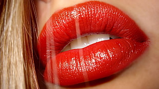 close-up photography of woman's red lips