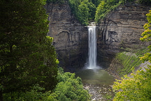 waterfall between rock cliff HD wallpaper