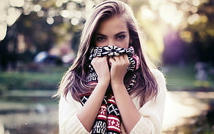 portraiture photography of woman smelling her tribal scarf HD wallpaper