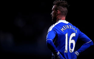 photo of Meireles number 16 standing with two hands on waist