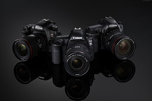 three black Canon DSLR cameras