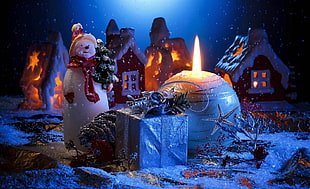 snowman beside candle HD wallpaper