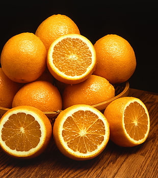 bunch of orange fruits on top of table