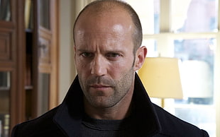 Jason Statham wearing black jacket during daytime