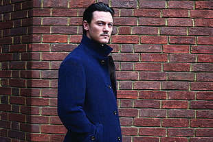 man wearing blue trench coat