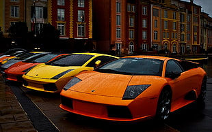 red and black car bed frame, car, Lamborghini, orange cars, yellow cars HD wallpaper