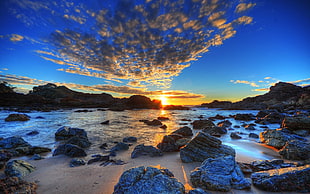 panoramic photography of body of water full of rock during daylight HD wallpaper