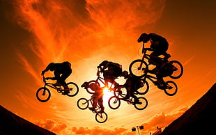 bikers silhouette on sunset high-saturated photography