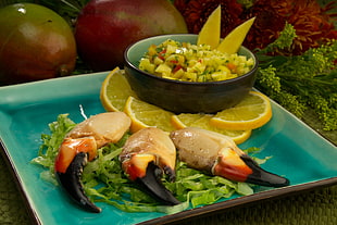 lobster cuisine with sliced lemon and lettuce side dish