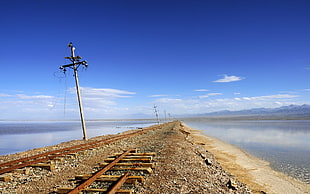 white electric post, railway, abandoned, rust