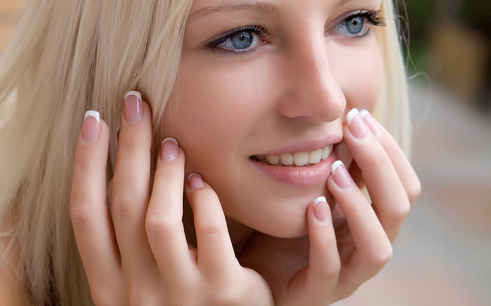 woman touching her face HD wallpaper