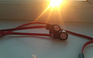 close up photo of red Beats by Dr.Dre earphones HD wallpaper