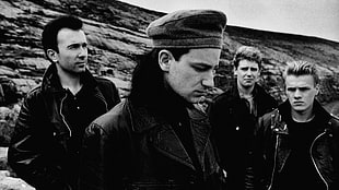 gray scale photo of group of man's in black leather jackets