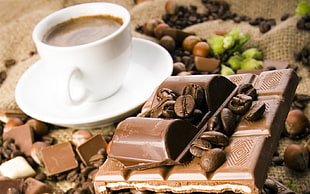 chocolate bar near cup of coffee