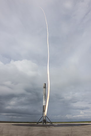 gray concrete tower, SpaceX, rocket, long exposure, clouds
