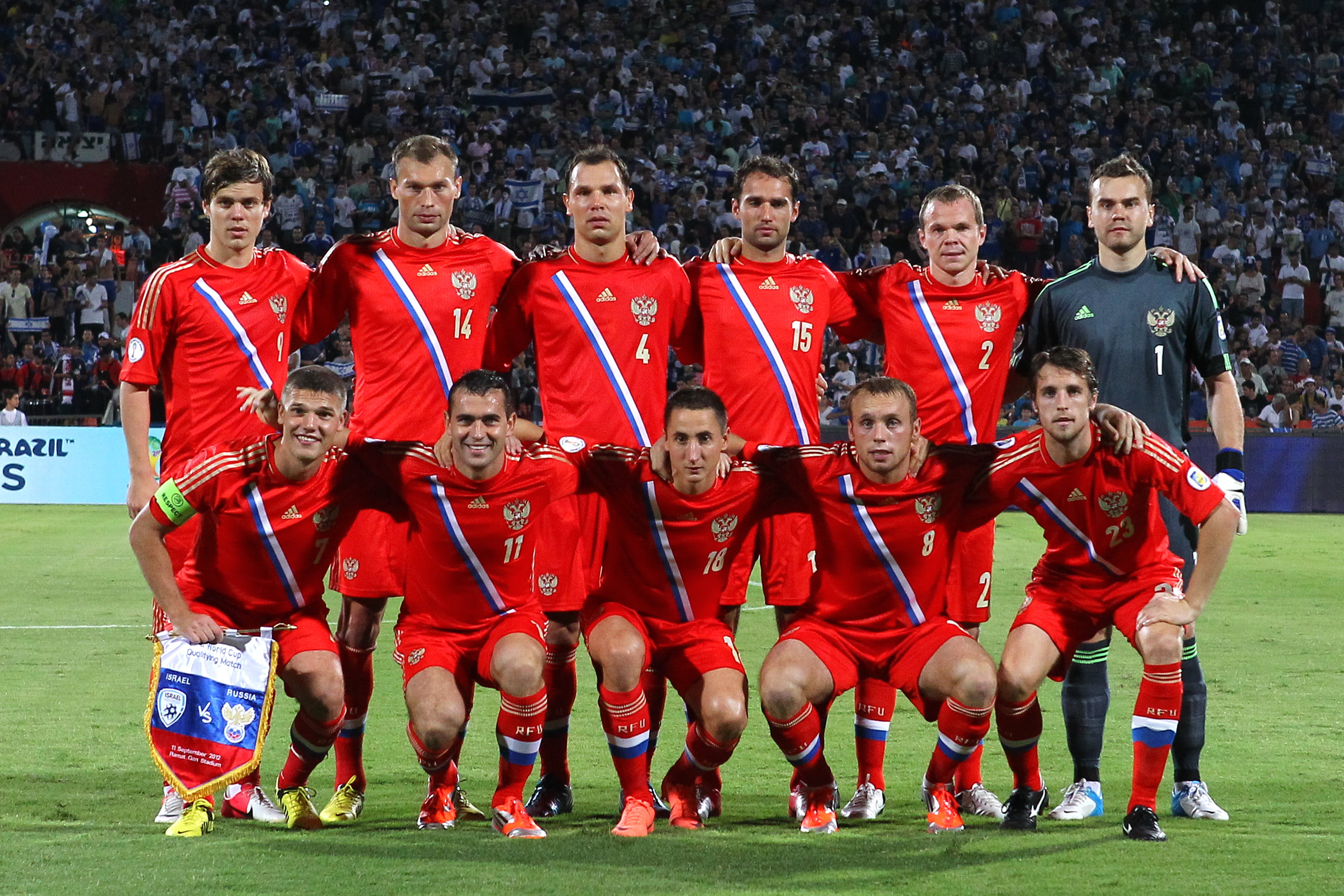 football team in the middle of stadium