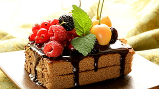slices of cake with fruit toppings, cake, chocolate, fruit, food