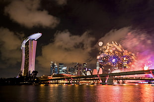 marina bay of sand with fireworks at nighttime