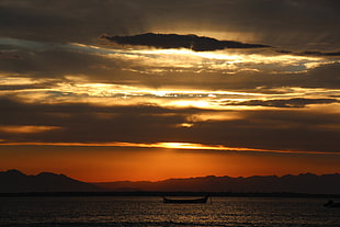 silhouette of boat during golden hour, sunset, sea, landscape, clouds